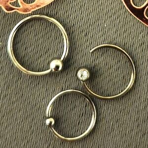 Set the three silver hoop piercings